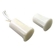Concealed round magnetic door contact sensor designed for recessed installation on entry points.